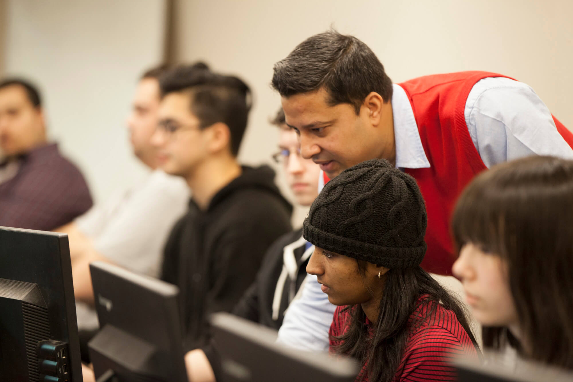 TRU professor helping a student.